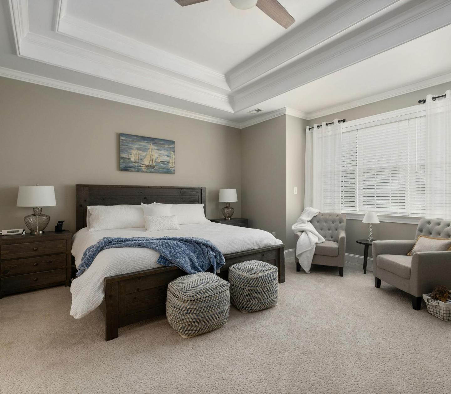 A well-appointed primary bedroom inspected in a home in Oak Point, TX.