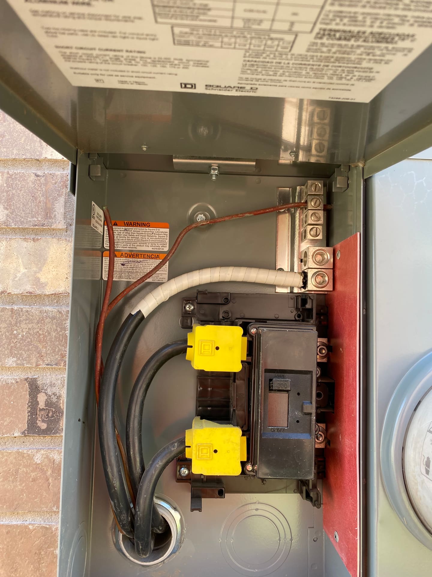 An exterior residential electrical panel and meter examined during a buyer inspection.